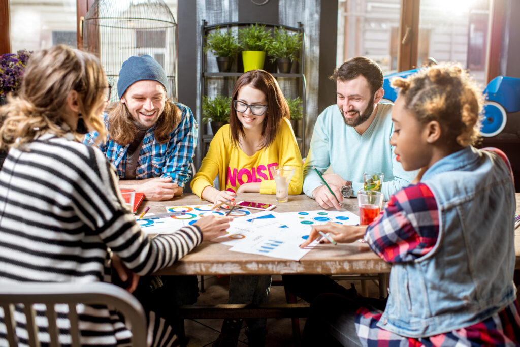 Group of people working together in the cafe