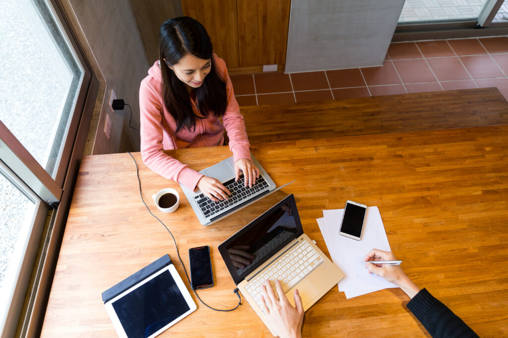 Two people work together at home